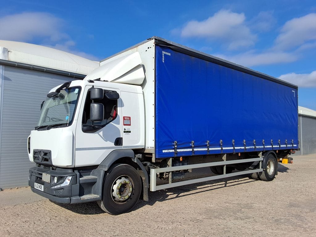 A white Renault rigid lorry with a blue curtainside body